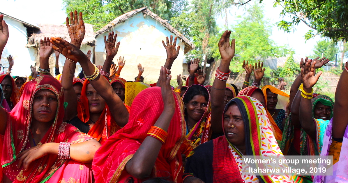 Women raising hands at Itarhawa village 2019